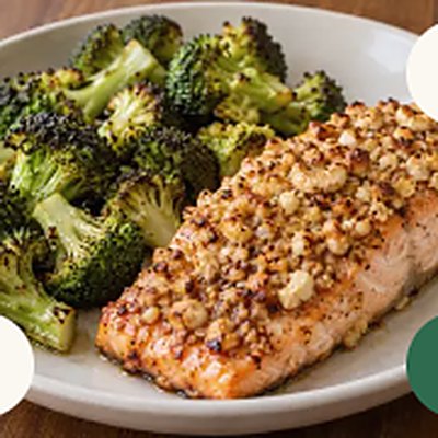 Cashew-crusted salmon, broccoli, served in a white bowl